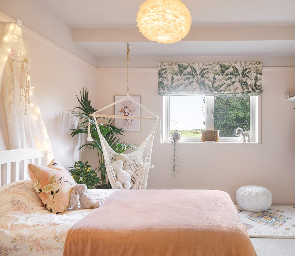 Girls bedroom design, soft pink, textural materials, tropical plants and green fabric.